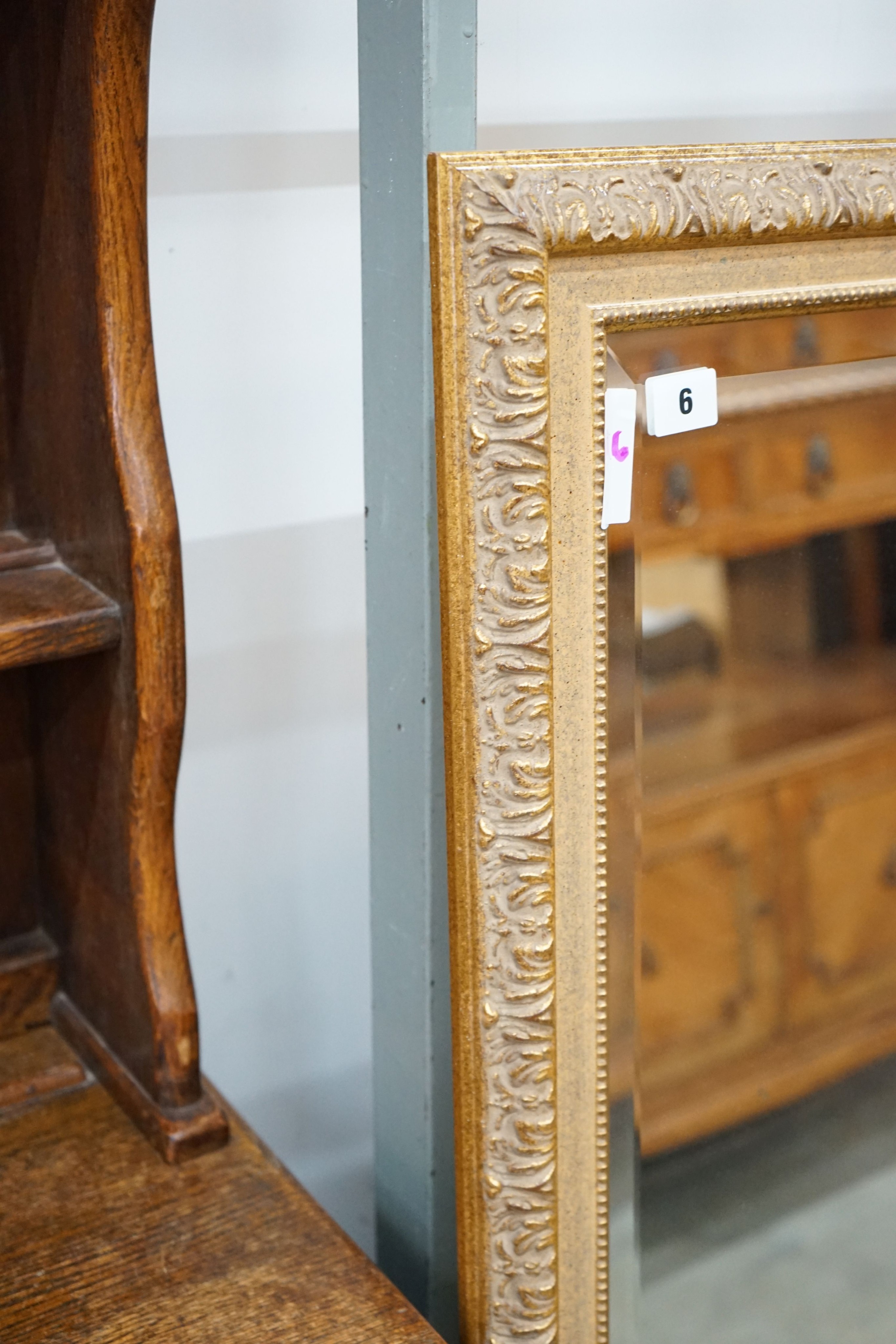 A reproduction gilt framed wall mirror, width 103cm, height 135cm